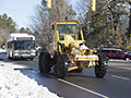 GRADER AND BUS IN SNOW