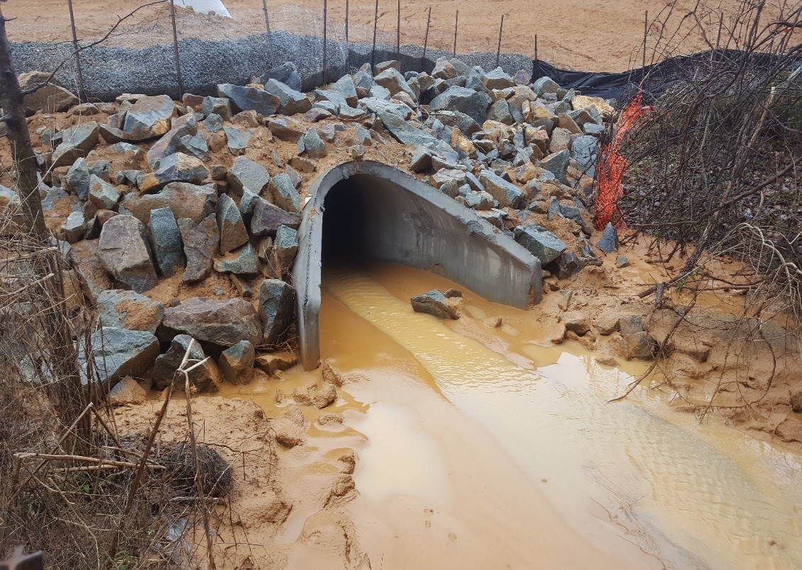 Stormwater outfall full of sediment from a construction site