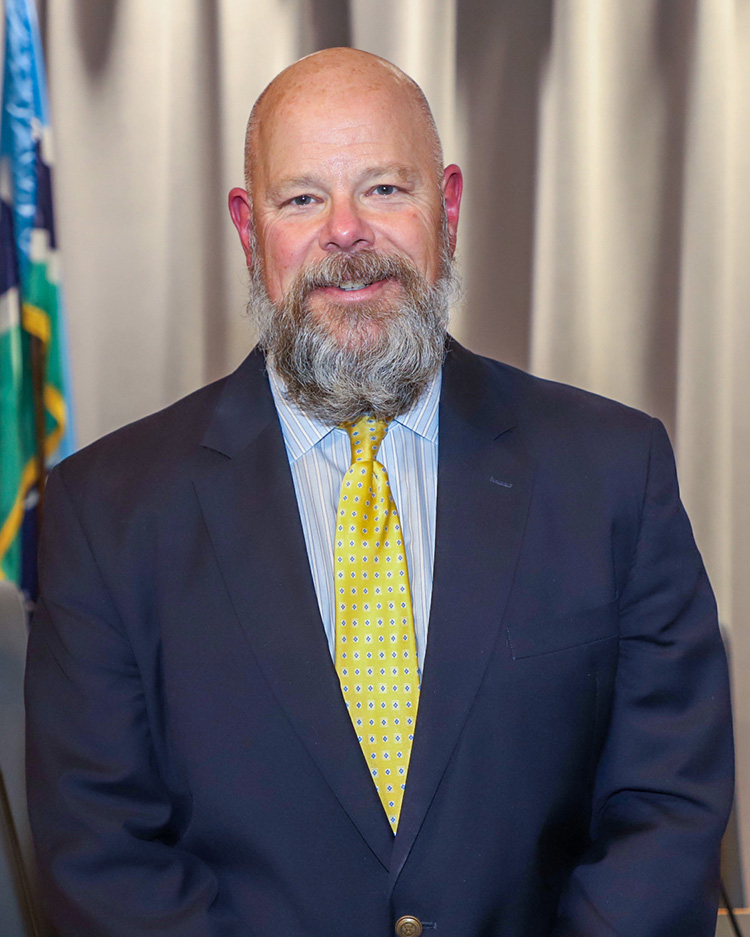 Interim Town Manager Chris Blue portrait in Town Hall Council Chamber