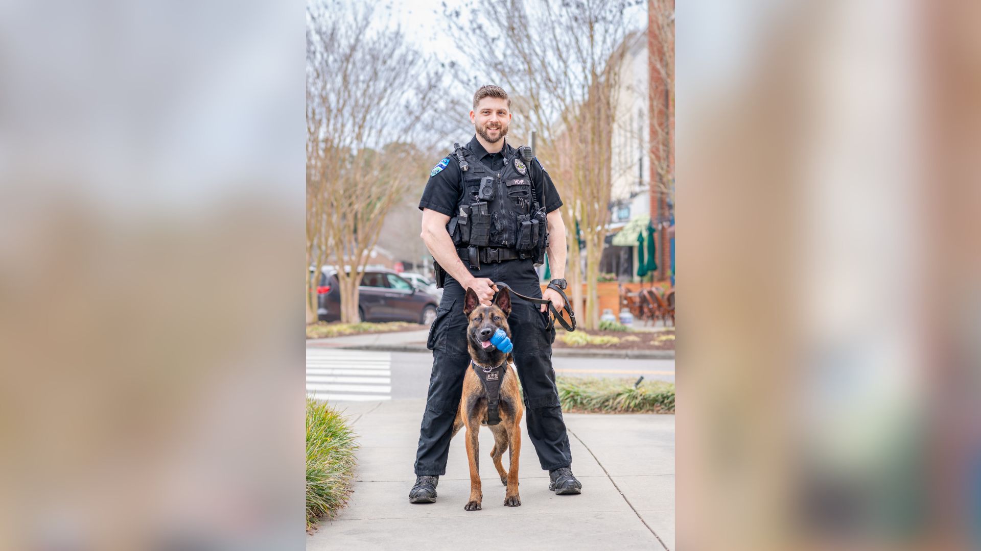 Ofc. Hove poses with K9 Bain