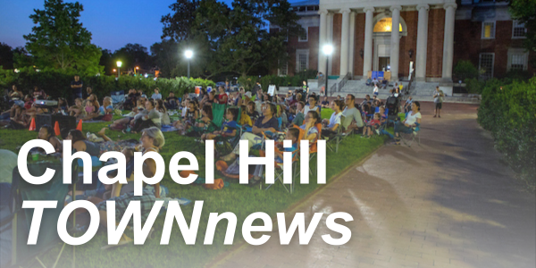 Chapel Hill TOWNnews over people on grass watching movie