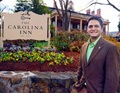 Photo of Mayor Mark Kleinschmidt in front of Carolina Inn