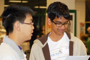 PHOTO Young men at public meeting 